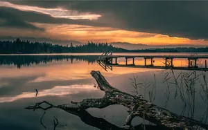 Awe-inspiring View Of Mountains And Valley With A Vibrant, Colorful Sunset Wallpaper