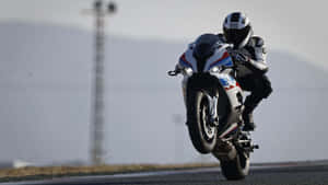 B M W S1000 R R Wheelie Action Wallpaper