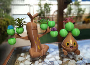 Baby And Grown Sudowoodo Figurines Wallpaper