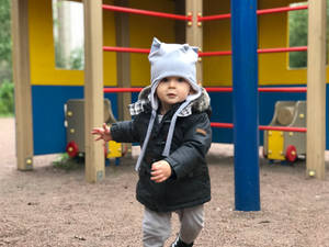 Baby In Playground Wallpaper