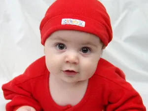 Baby In Red Outfit Is Ready For Playtime Wallpaper