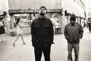 Baby Keem In Street Grayscale Wallpaper