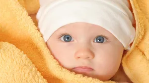 Baby Photography With Stunning Blue Eyes Wallpaper