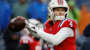 Bailey Zappe Patriots Quarterback Preparing Pass Wallpaper