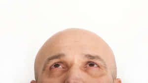 Bald Man Looking Upward Wallpaper