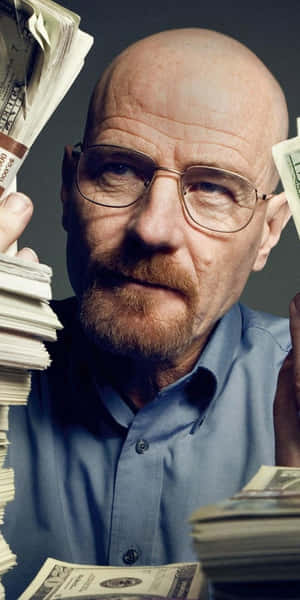 Bald Man With Glassesand Money Stacks Wallpaper