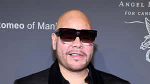 Bald_ Man_with_ Sunglasses_at_ Event Wallpaper