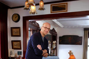 Bald Manin Traditional Room Leaningon Doorframe Wallpaper