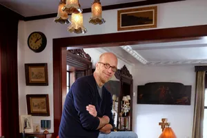 Bald Manin Traditional Room Leaningon Doorframe Wallpaper