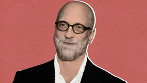 Bald Manwith Glasseson Red Background Wallpaper