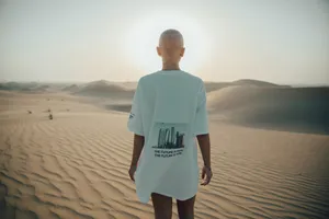 Bald Person Desert Walk Wallpaper