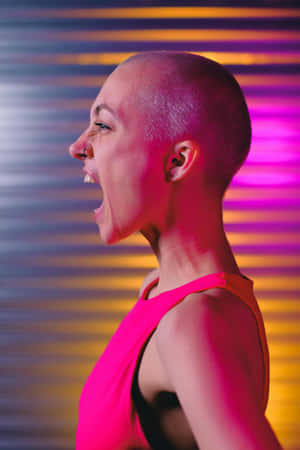 Bald Woman Laughing Against Colorful Background Wallpaper