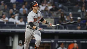 Baltimore Orioles Player Swinging Bat Wallpaper