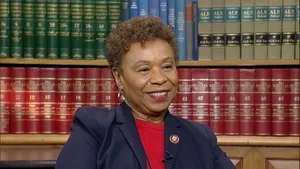 Barbara Lee Engaged In Reading At The Library Wallpaper
