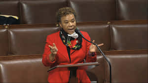 Barbara Lee Passionately Gesturing During A Speech Wallpaper