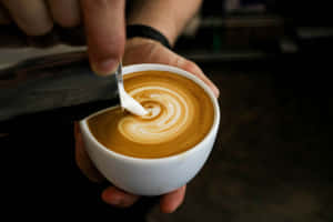 Barista Creating Latte Art Wallpaper