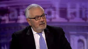 Barney Frank Against A Violet Background Wallpaper