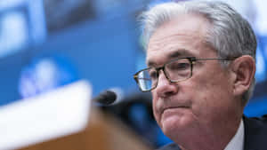 Barney Frank With Lips Pursed In Discussion Wallpaper