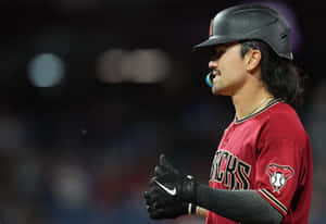 Baseball Player Adjusting Gloves During Game Wallpaper