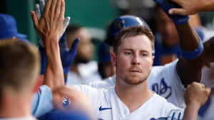 Baseball Player Celebratingwith Team Wallpaper