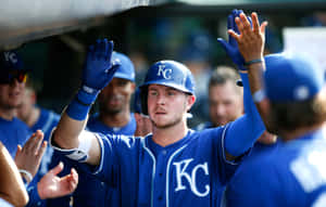 Baseball Player Celebratingwith Team Wallpaper