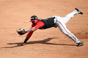 Baseball Player Diving Catch Attempt Wallpaper