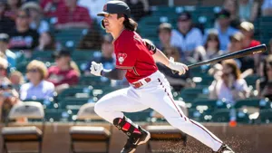 Baseball Player Hitting Ball Dynamic Swing Wallpaper