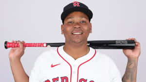 Baseball Player Rafael Devers Smiling With Bat Wallpaper