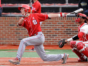 Baseball Player Swinging Bat During Game.jpg Wallpaper
