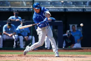 Baseball Player Swinging Bat K C Uniform Wallpaper