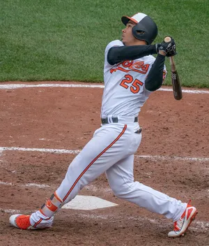 Baseball Player Swinging Bat Wallpaper