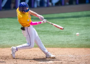 Baseball Player Swinging Bat Wallpaper