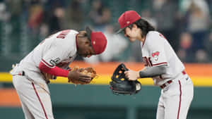 Baseball Players Celebrating Victory Wallpaper