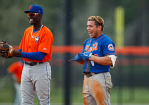 Baseball Players Laughing During Game.jpg Wallpaper