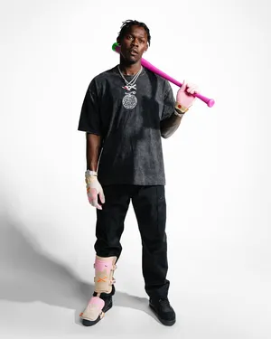 Baseball Playerwith Pink Batand Brace Wallpaper