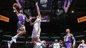 Basketball Athlete Mid Air Shot Attempt Wallpaper