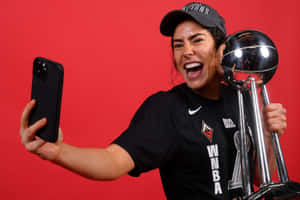 Basketball Champion Selfiewith Trophy Wallpaper