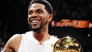 Basketball Champion Smiling With Trophy.jpg Wallpaper