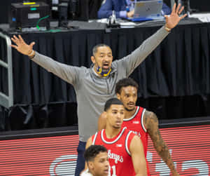 Basketball Coach Gesturing During Game Wallpaper