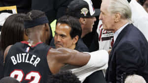 Basketball Coach Team Huddle During Game Wallpaper