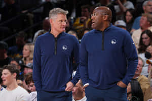 Basketball Coaches Court Side Discussion Wallpaper