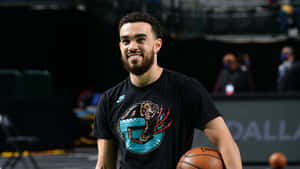 Basketball Great Athlete Tyus Jones Wallpaper