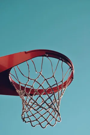 Basketball Hoop Against Blue Sky Wallpaper