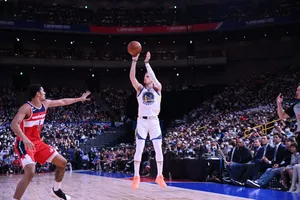 Basketball Jump Shot Moment Wallpaper