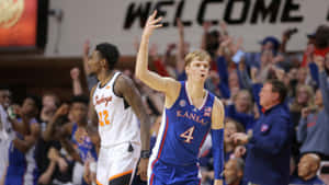 Basketball_ Player_ Celebrating_ Victory_ Kansas_ Uniform Wallpaper