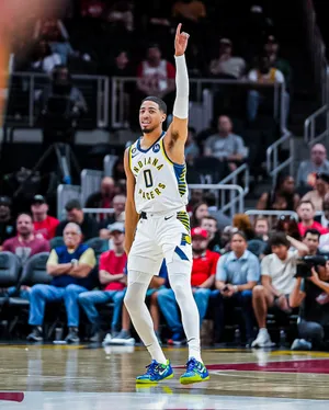 Basketball Player Celebratingon Court.jpg Wallpaper