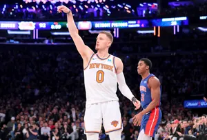 Basketball Player Celebratingon Court Wallpaper