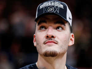 Basketball Player Contemplative Moment Wallpaper