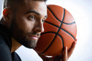 Basketball Player Contemplative Pose Wallpaper