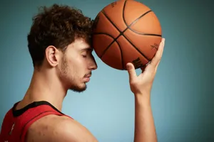 Basketball Player Contemplative Pose Wallpaper